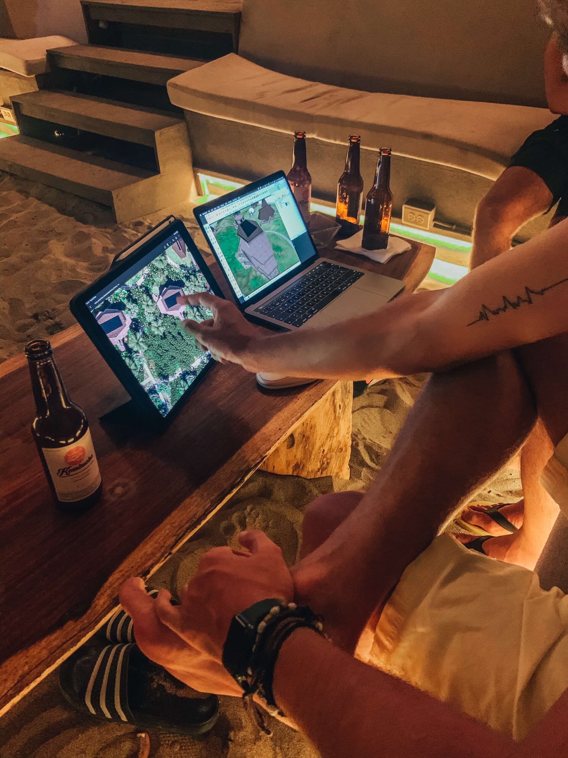 Reviewing project renders on the beach